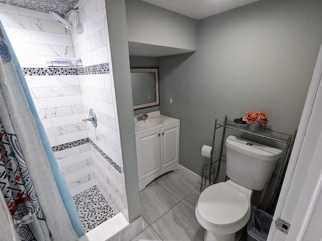 bathroom featuring tile patterned floors, a shower with curtain, toilet, and vanity