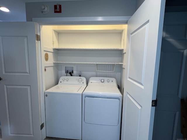laundry area with washing machine and dryer