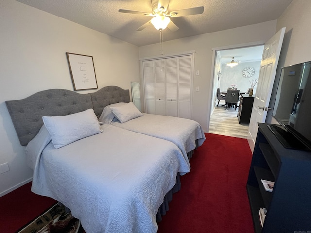 bedroom featuring a closet and a ceiling fan