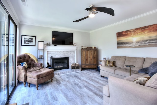 270 Heritage Vlg Unit D, Southbury, CT 06488 - living area with crown molding, wood finished floors, ceiling fan, and a brick fireplace