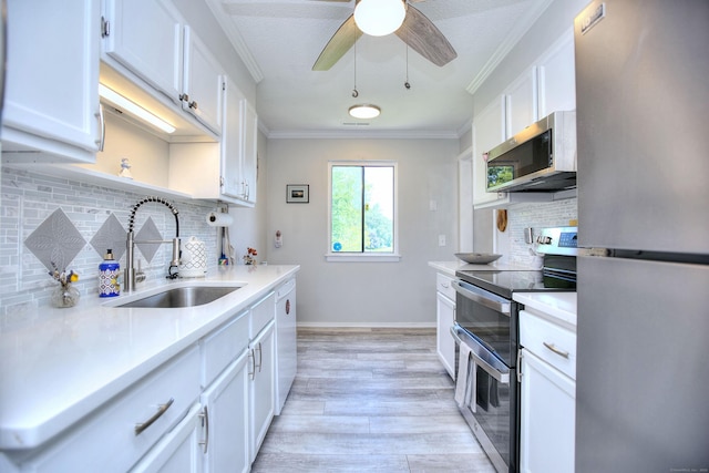 270 Heritage Vlg Unit D, Southbury, CT 06488 - kitchen with stainless steel appliances, light countertops, decorative backsplash, ornamental molding, and white cabinets