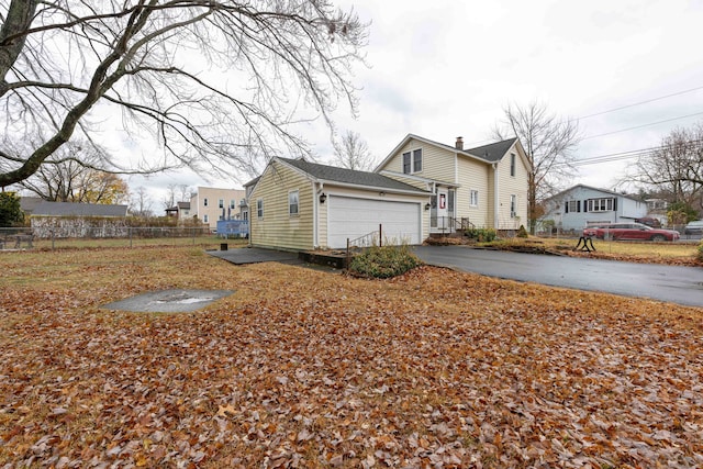 view of side of home with a garage