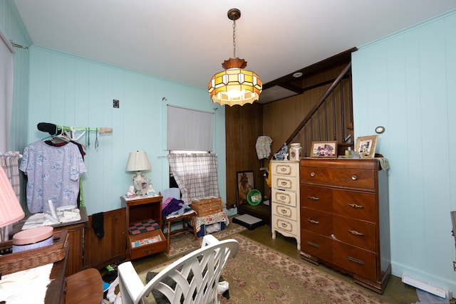 bedroom with wooden walls