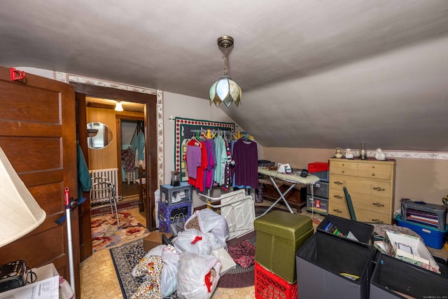 interior space featuring lofted ceiling and radiator