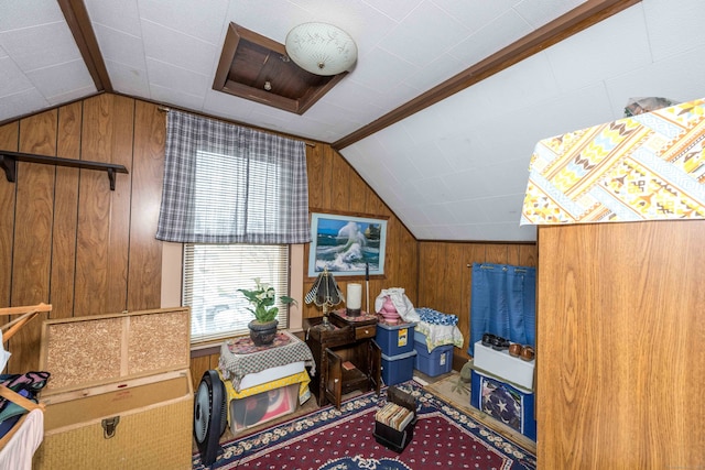 additional living space with lofted ceiling and wooden walls