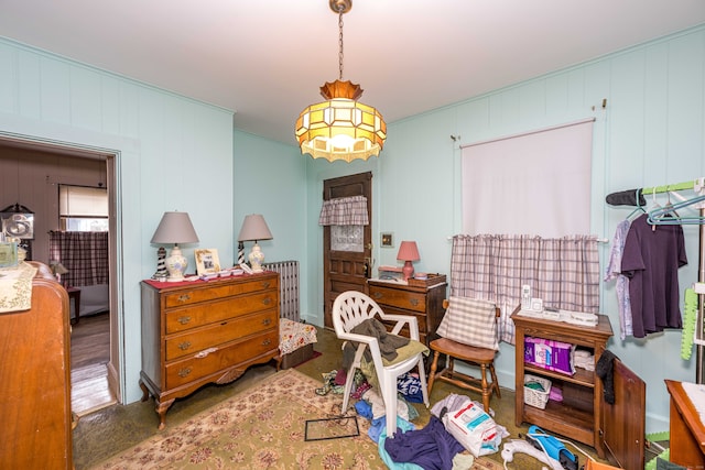 bedroom with wooden walls