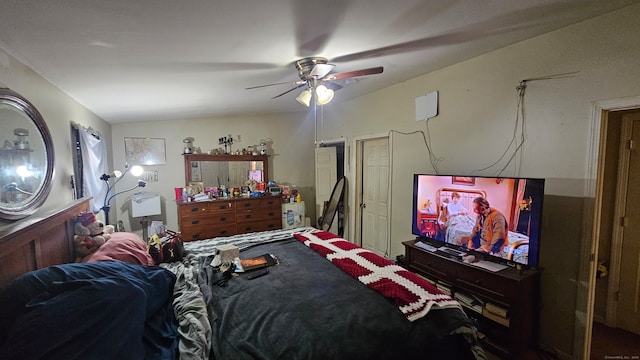 bedroom featuring ceiling fan and vaulted ceiling