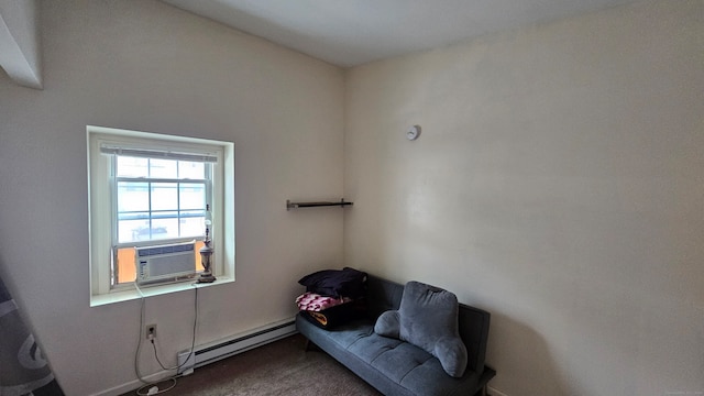 sitting room with carpet, a baseboard radiator, and cooling unit