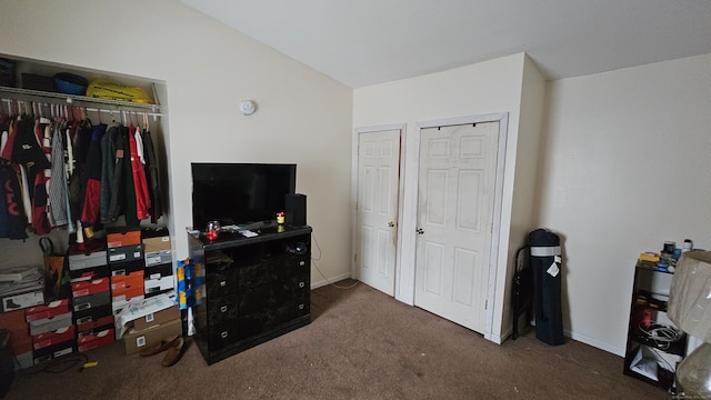 bedroom featuring dark colored carpet