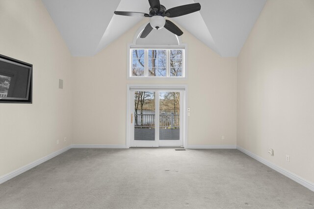 spare room with light carpet, ceiling fan, and lofted ceiling