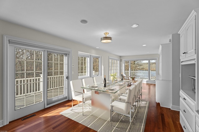 dining room with dark wood-type flooring