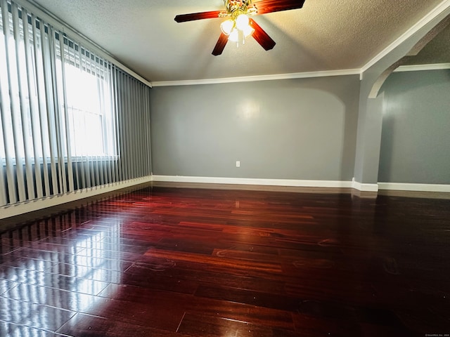 empty room featuring crown molding, ceiling fan, a textured ceiling, and hardwood / wood-style flooring