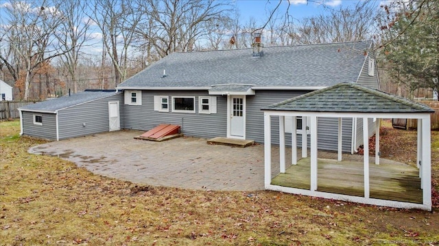 back of property featuring a patio area and a deck