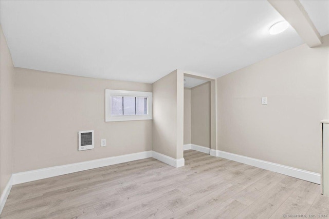 interior space featuring light hardwood / wood-style flooring and heating unit