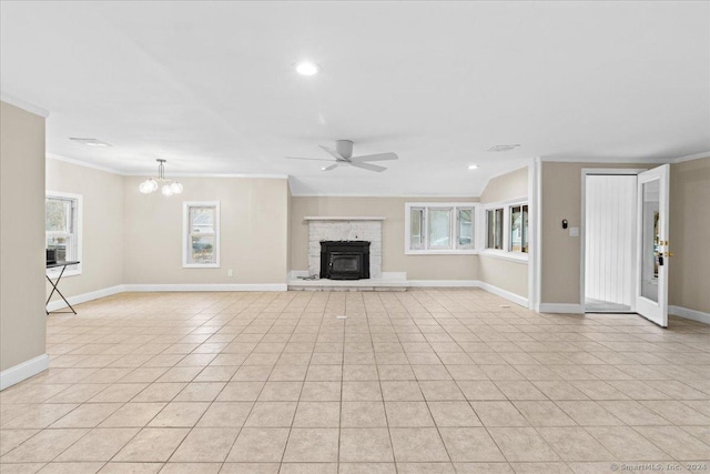 unfurnished living room with crown molding, ceiling fan with notable chandelier, and light tile patterned floors