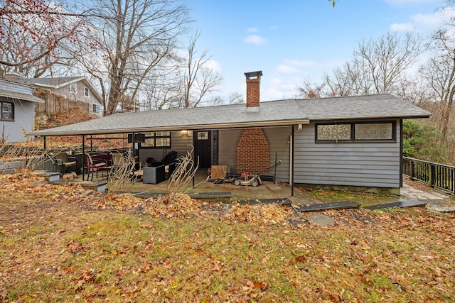 back of house with a patio