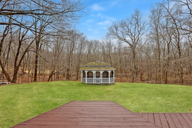 deck featuring a yard and a gazebo