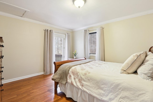 bedroom with crown molding and hardwood / wood-style flooring