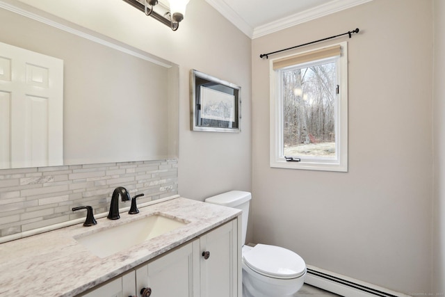 bathroom with vanity, tasteful backsplash, ornamental molding, a baseboard radiator, and toilet