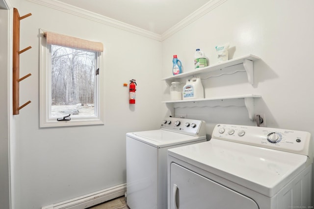 washroom with a baseboard radiator, ornamental molding, washer and clothes dryer, and plenty of natural light