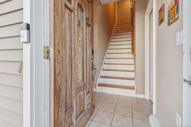 staircase with tile patterned floors