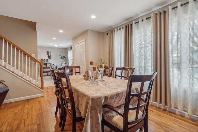 dining area featuring light wood-type flooring