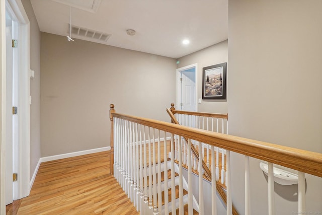 hall with light hardwood / wood-style flooring