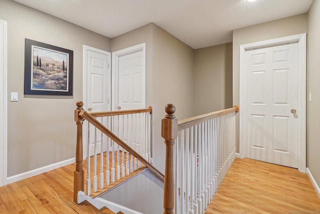 hall with light hardwood / wood-style flooring