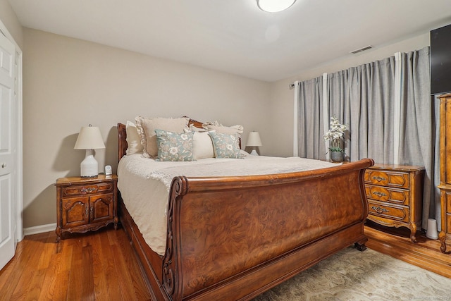 bedroom featuring wood-type flooring