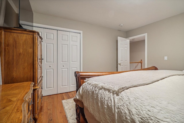 bedroom featuring light hardwood / wood-style floors and a closet