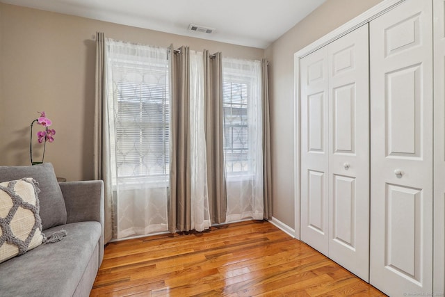 sitting room with light hardwood / wood-style floors