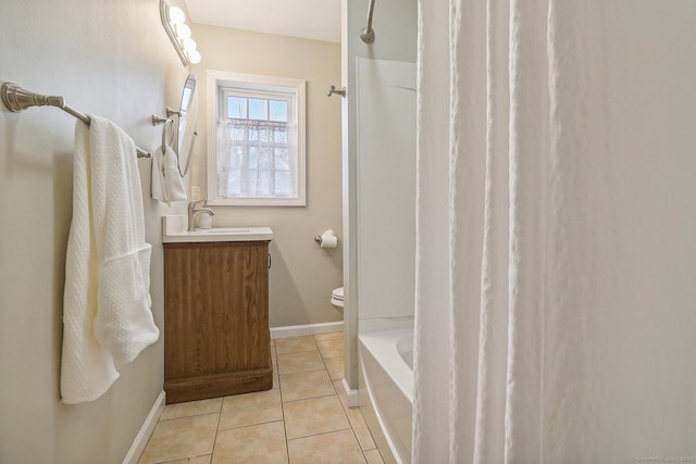 full bathroom with toilet, vanity, tile patterned floors, and  shower combination