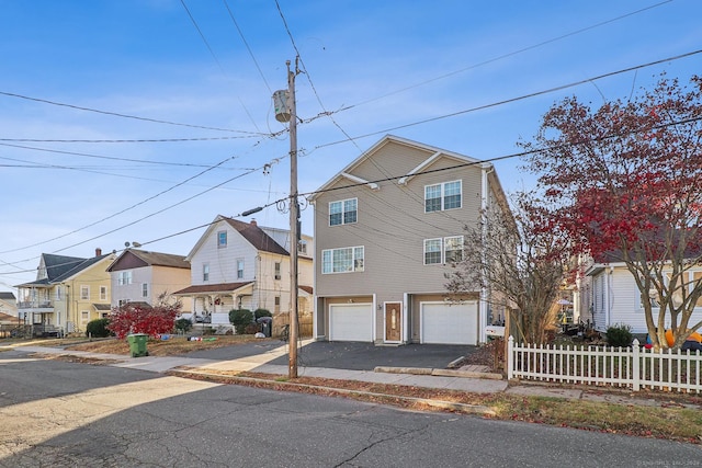 front of property with a garage