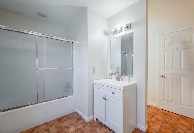 bathroom with shower / bath combination with glass door and vanity