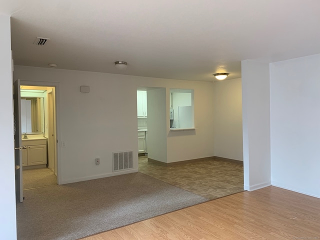 spare room featuring light wood-type flooring