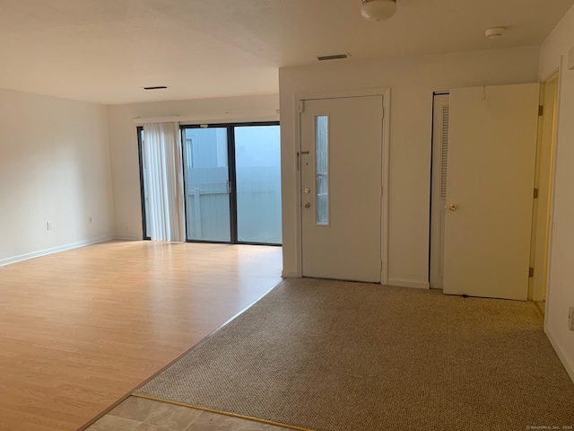 spare room with light wood-type flooring