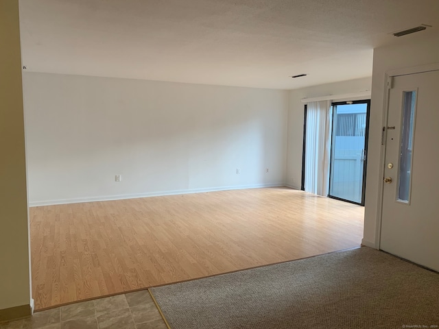 unfurnished room featuring light wood-type flooring