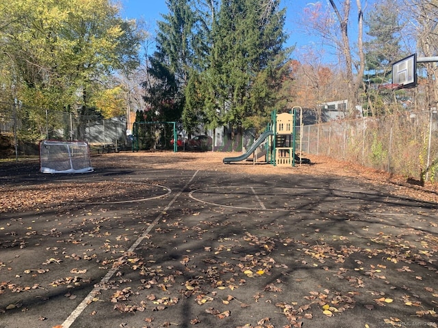 view of jungle gym with basketball hoop