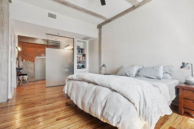 bedroom with light wood-type flooring and ceiling fan