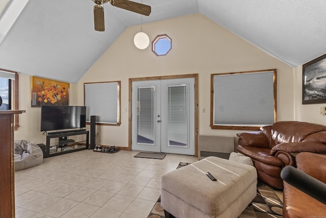 tiled living room with french doors, vaulted ceiling, and ceiling fan