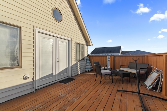 wooden deck featuring an outdoor living space