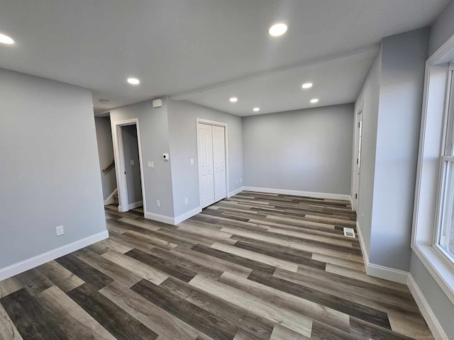 interior space with dark hardwood / wood-style floors