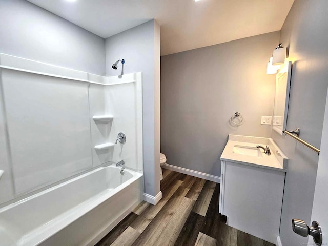 full bathroom with wood-type flooring, vanity, toilet, and tub / shower combination