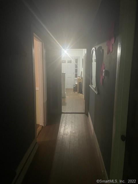 corridor featuring hardwood / wood-style floors