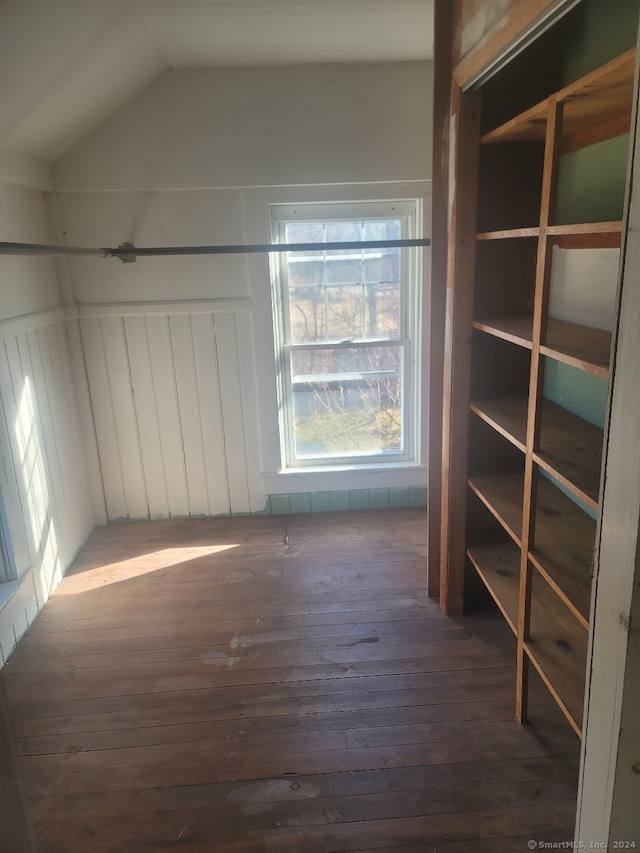 bonus room featuring lofted ceiling and dark hardwood / wood-style floors