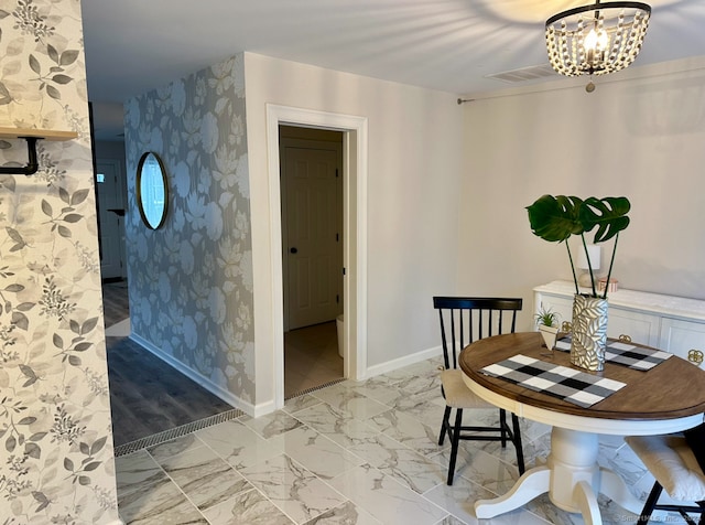 dining space featuring a chandelier