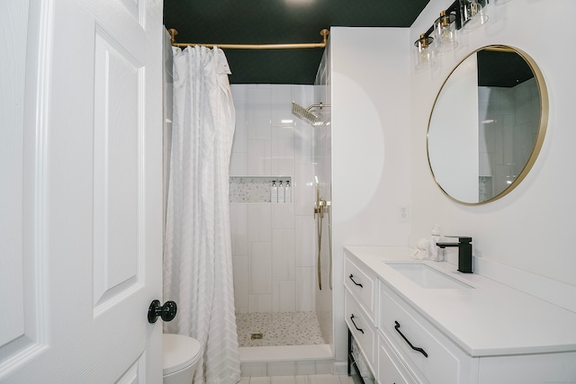 bathroom with tile patterned floors, a shower with curtain, vanity, and toilet