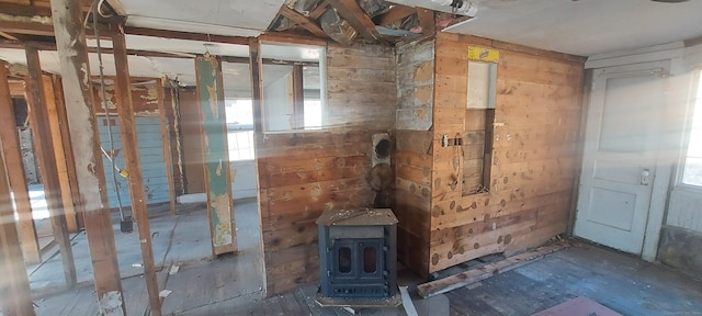 bathroom featuring a healthy amount of sunlight and a wood stove