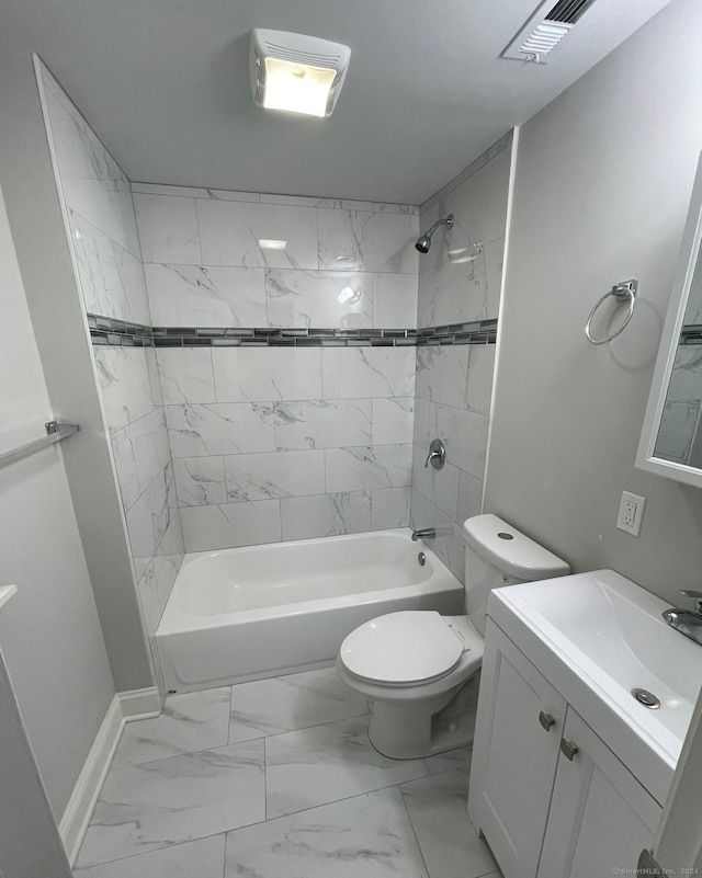 full bathroom with toilet, vanity, and tiled shower / bath combo