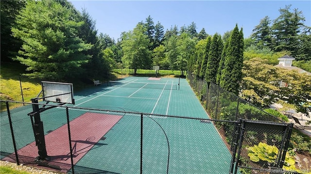 view of basketball court featuring tennis court